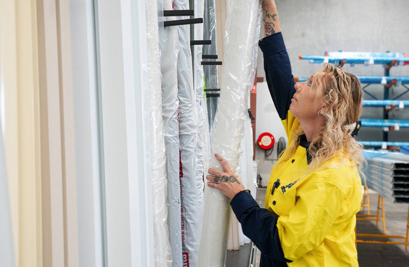 Image of Altec staff working in warehouse sorting materials..