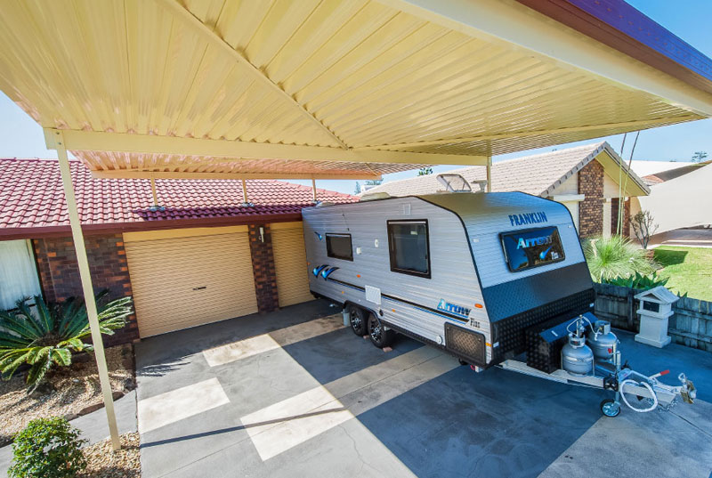 A backyard with flyover patio