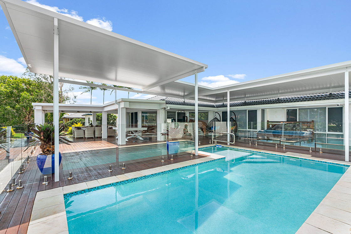 A backyard with flyover patio