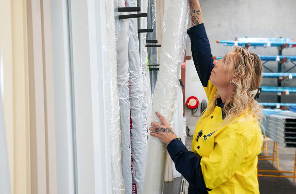 Image of Altec staff working in warehouse sorting materials..